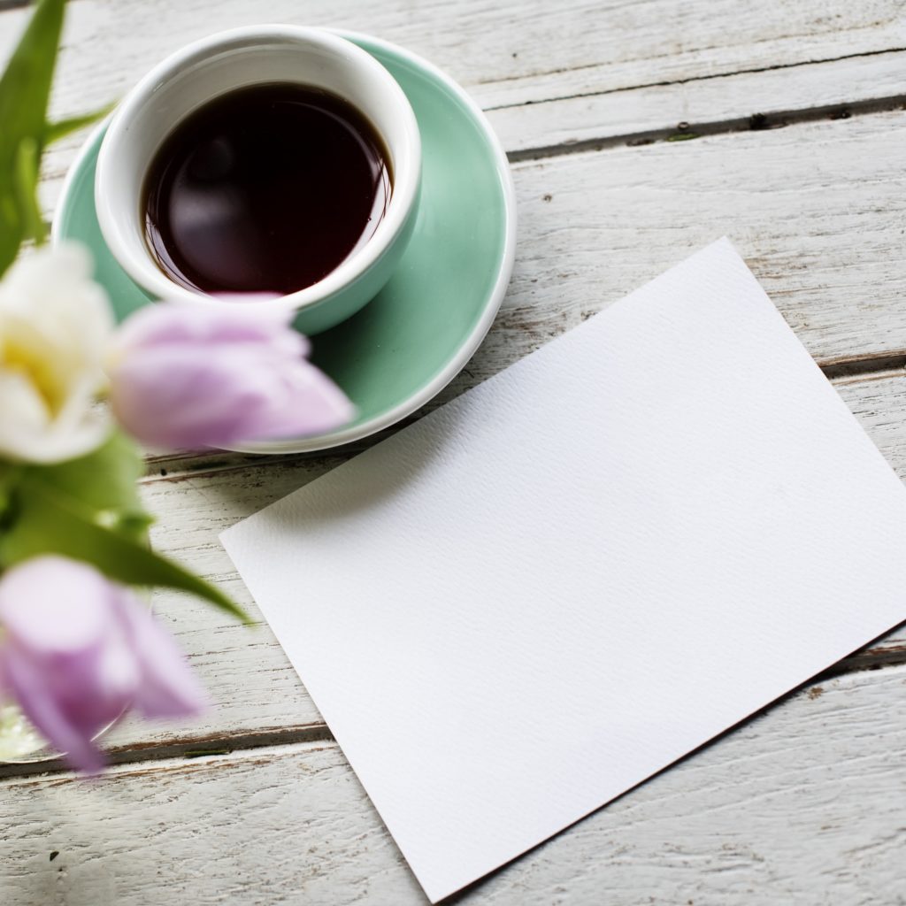 Design Space Empty Paper with Flowers and Coffee Cup Decoration